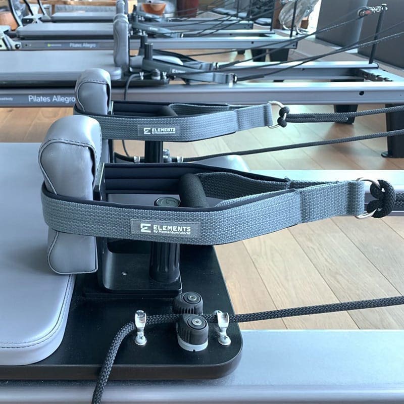 ELEMENTS Pilates Loop Roll Straps Pilates Loop Roll Straps grey and black on reformers with matching colours