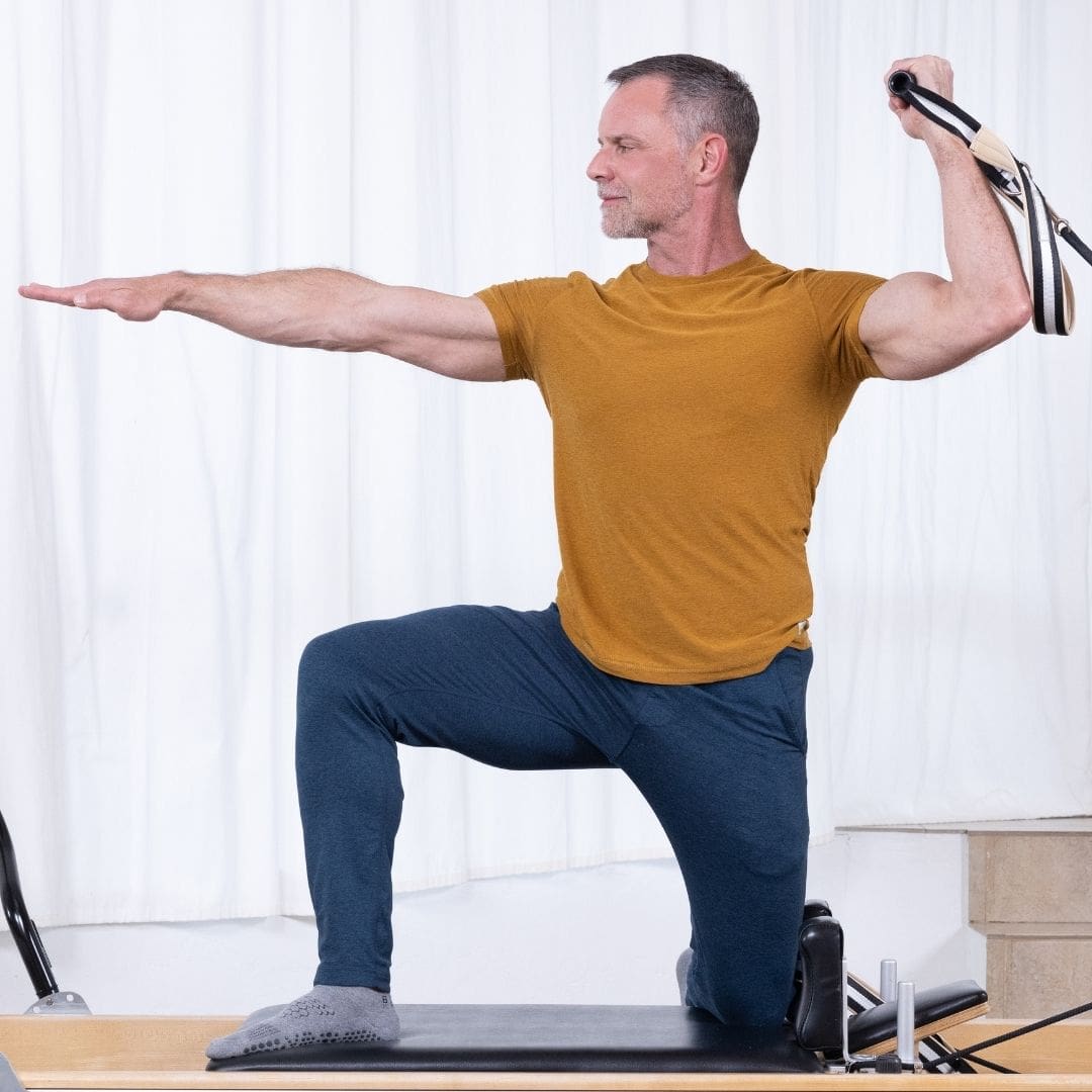 ELEMENTS_Sean_Bergara_Collection_05 Sean Bergara practising Pilates on Reformer with ELEMENTS Roll Handles