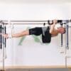 Michael on Pilates Cadillac ELEMENTS® slings, Fuzzies and pads shown in use on a Pilates Cadillac