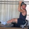 Sean Bergara doing pull-ups on Pilates Cadillac